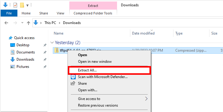 Windows File Explorer showing the extraction option for the Tftpd64 ZIP file in the Downloads folder.