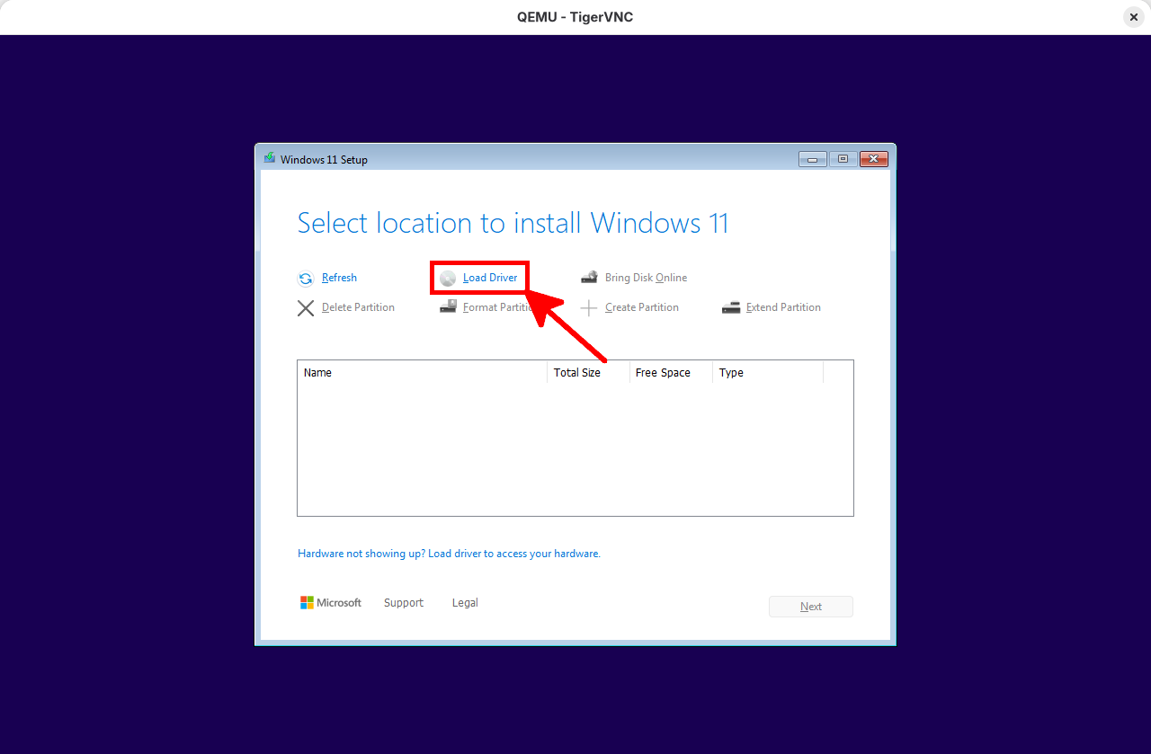 Windows 11 setup screen showing the Load Driver button during disk selection in QEMU virtual machine